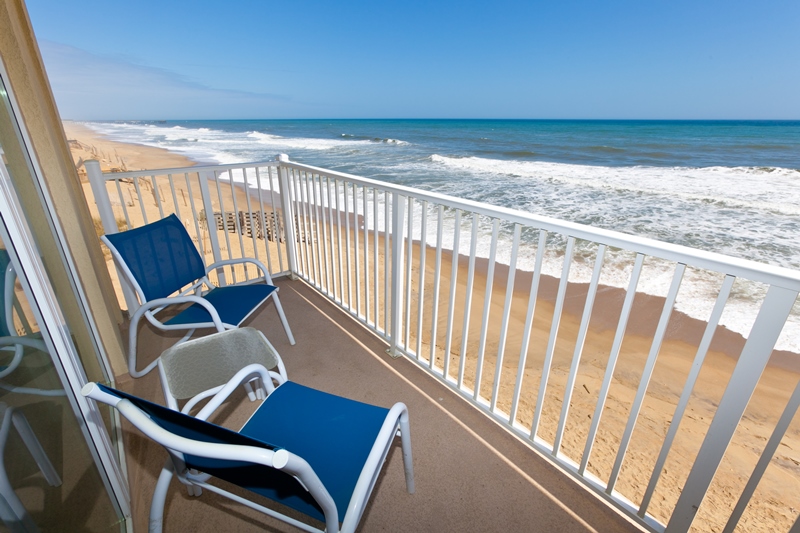 Blue chairs overlooking the ocean in kill devil hills