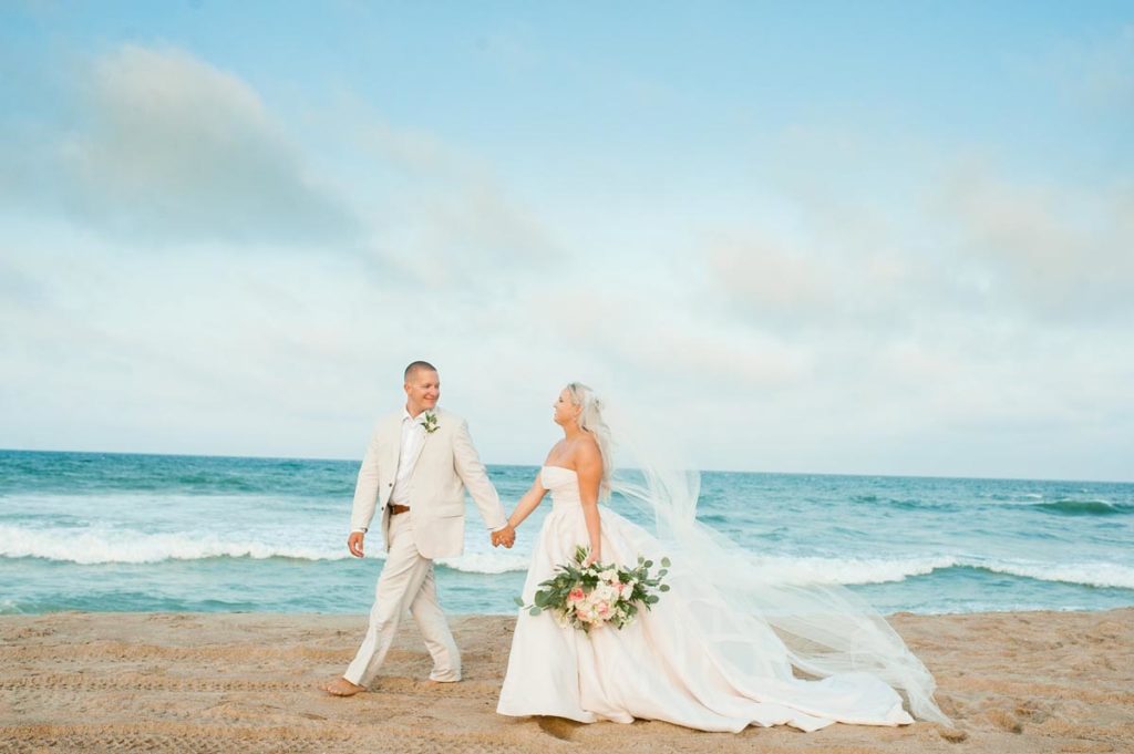 Bride and Groom Walking on the Beach