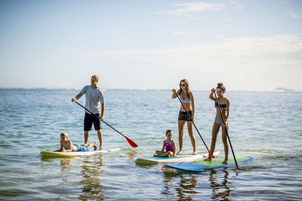 Family on a stand up paddle board