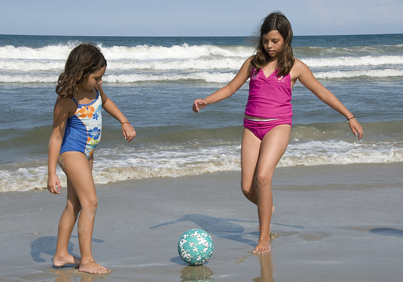 Local kids playing soccer on the beach at the Sea Ranch Resort