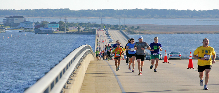 Marathon runners on the causeway to Roanoke Island