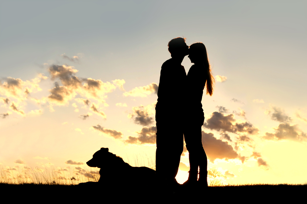 Romantic couple at sunset in Kill Devil Hills