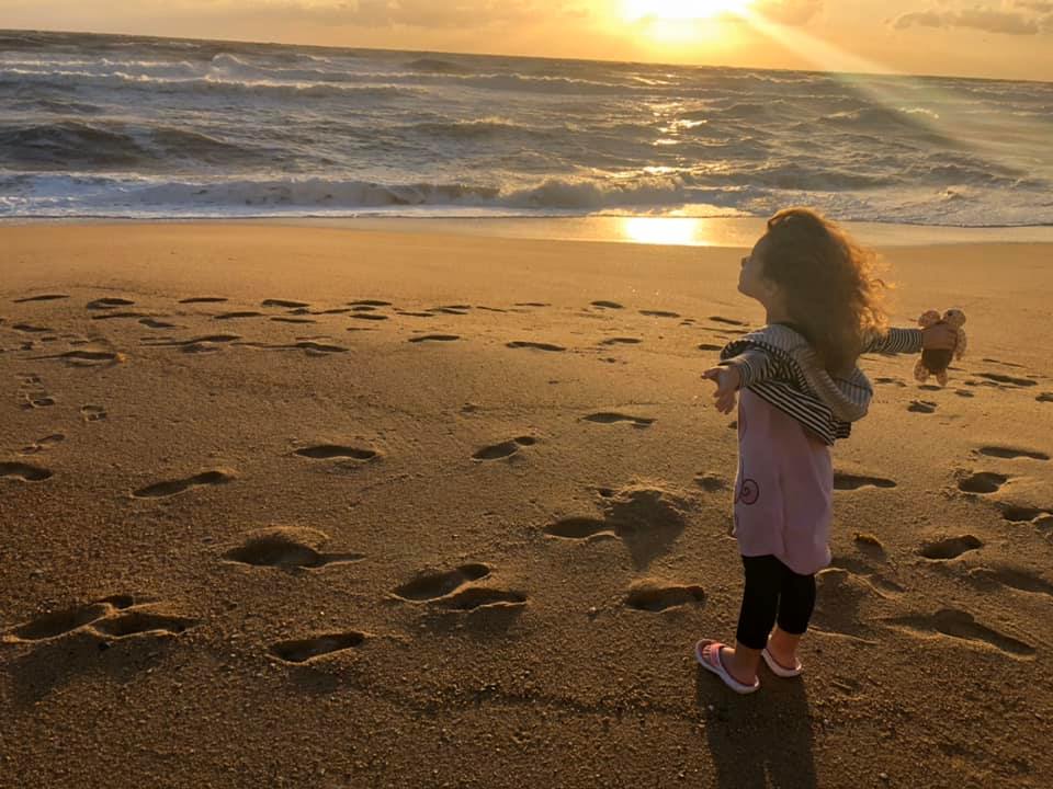 Little girl loving the beach near Kill Devil Hills