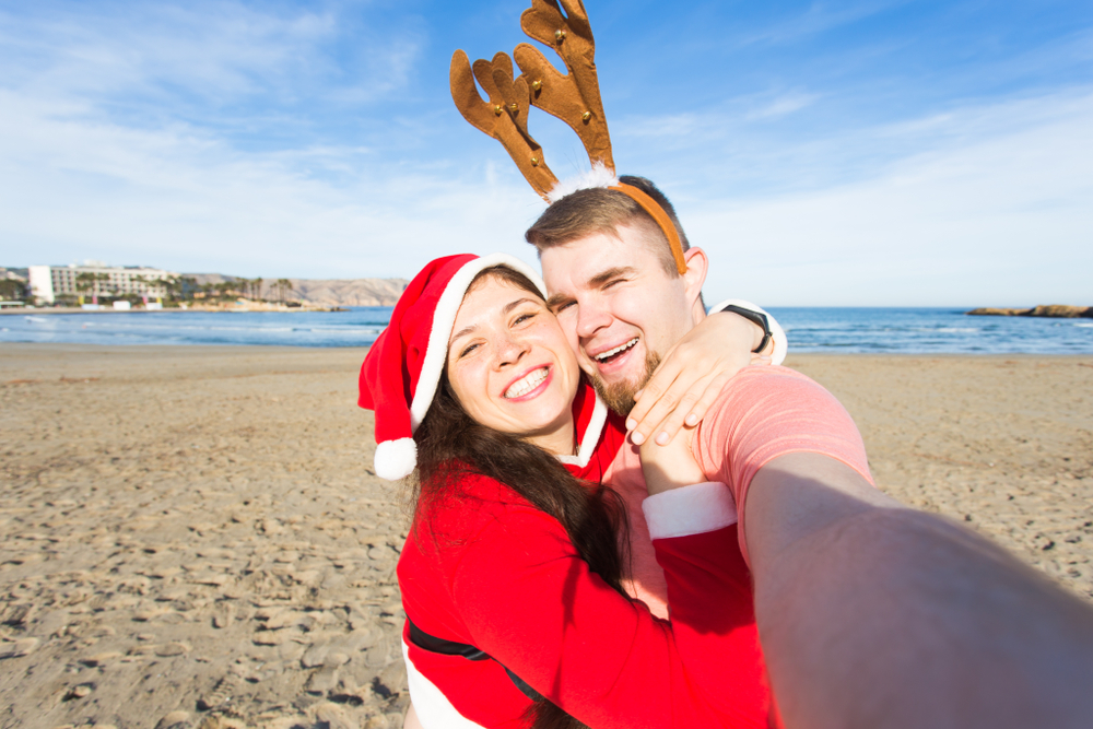 Couple on the beach for Christmas in North Carolina