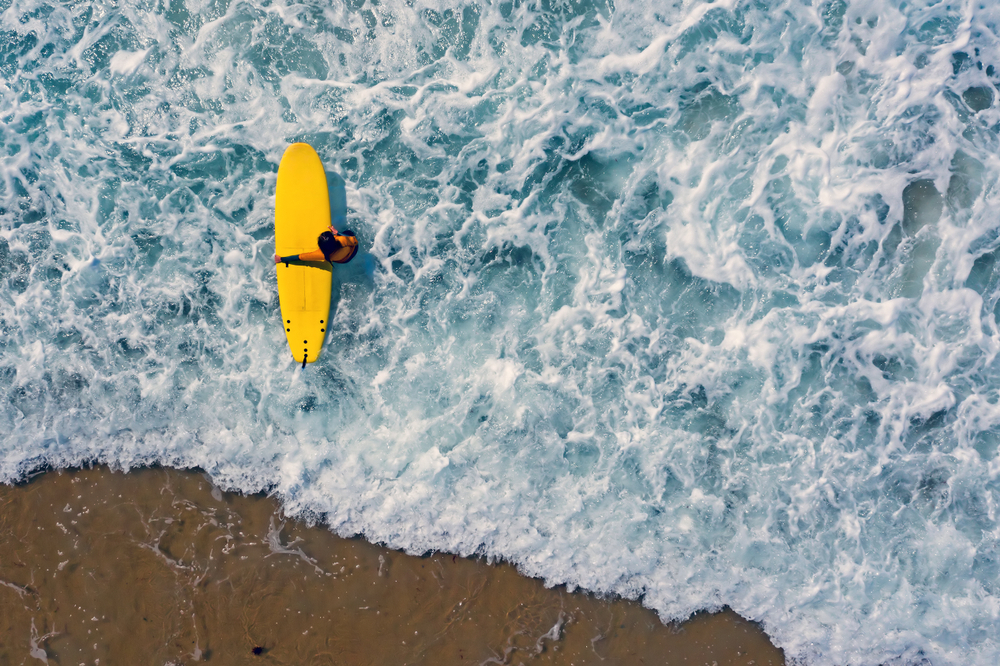 Outer Banks surfing aerial view of yellow board