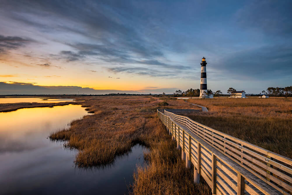A photo of a lighthouse in one of the stunning towns in Outer Banks, NC.