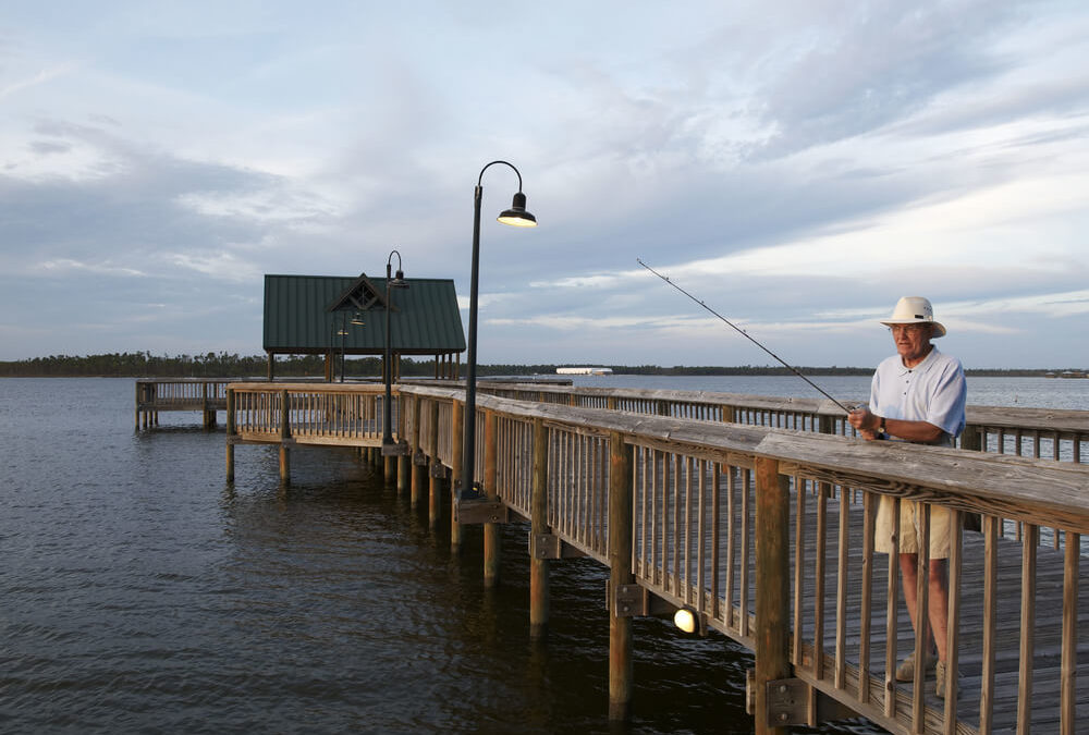 A man fishing from one of the piers in the Outer Banks.