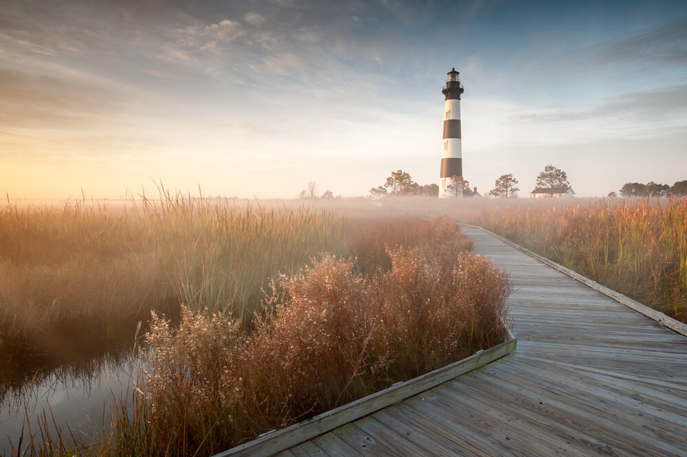 A photo of Bodie Island Lighthouse, one of the lighthouses in the Outer Banks.