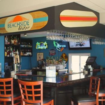 Beachside bistro bar interior with surfboard